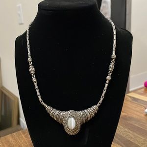 Beautiful silver tone necklace. White opalescent stone. 15”